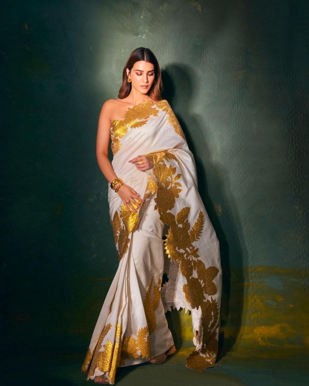 Kriti Sanon looks regal in the white and golden saree