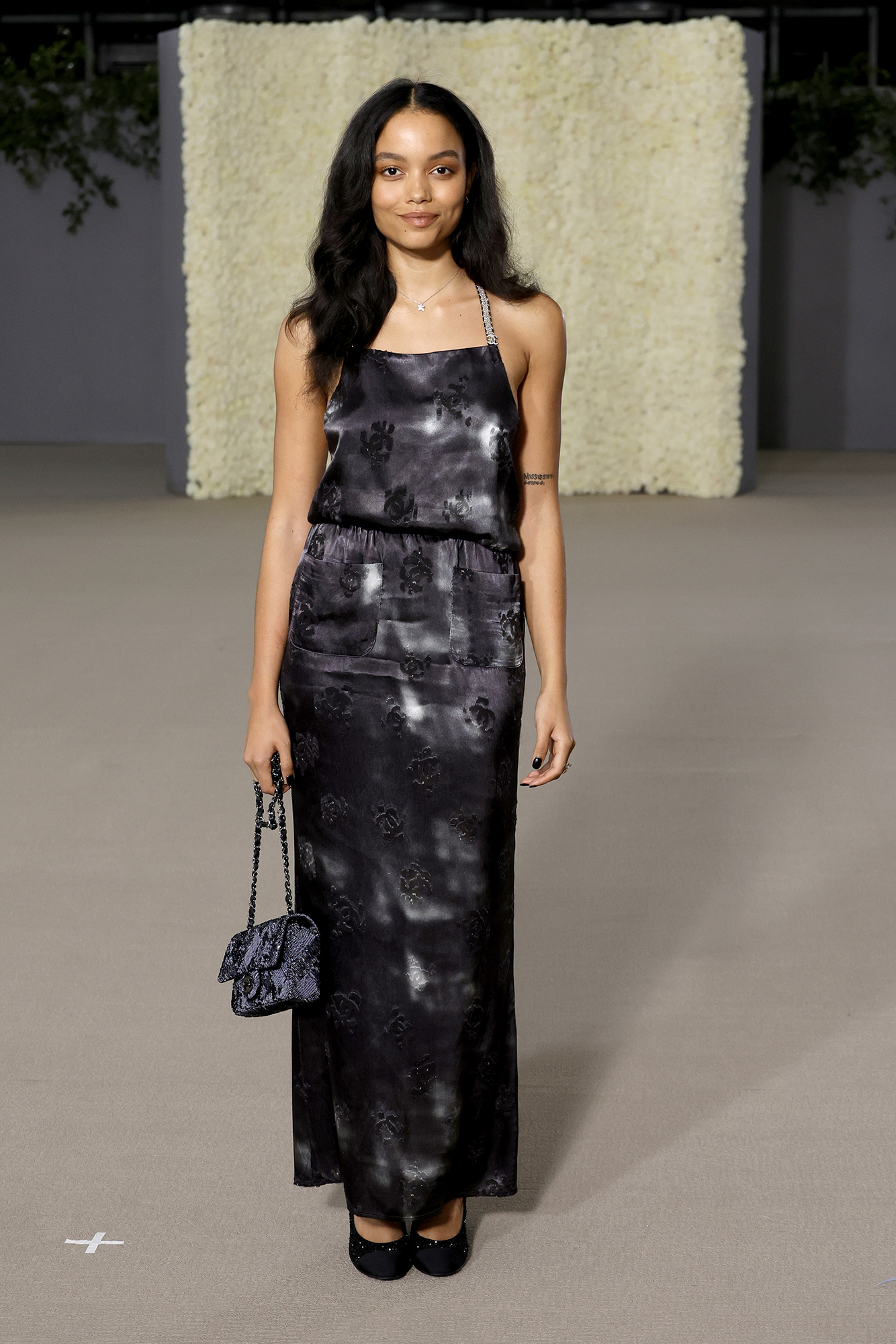 Whitney Peak wears Chanel at the Academy Museum Gala 2022.