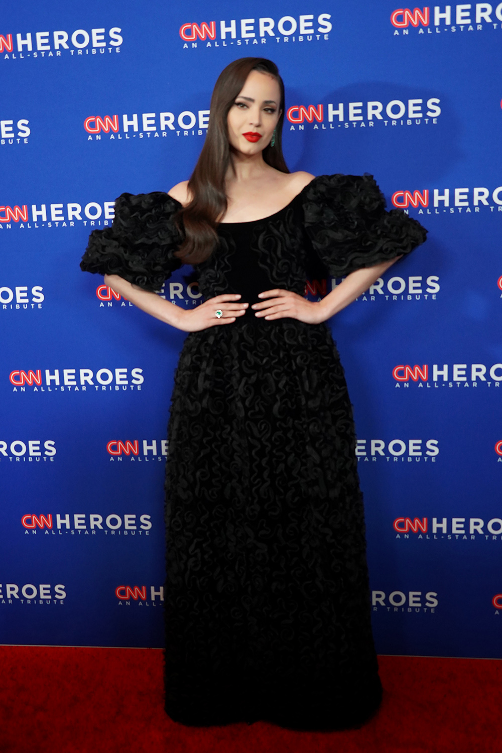 Sofia Carson oozed elegance at the 16th Annual CNN Heroes All Star Tribute. Her black gown had a lush texture and puffy sleeves