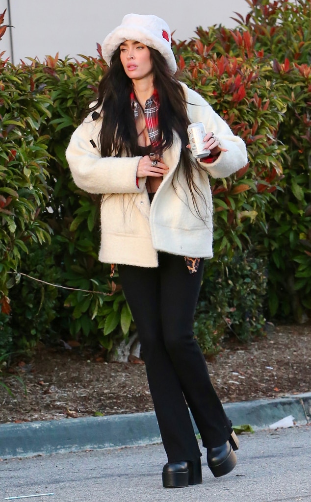 Megan Fox On the go! The actress spends her day grocery shopping in a fuzzy hat, white coat and black slacks.