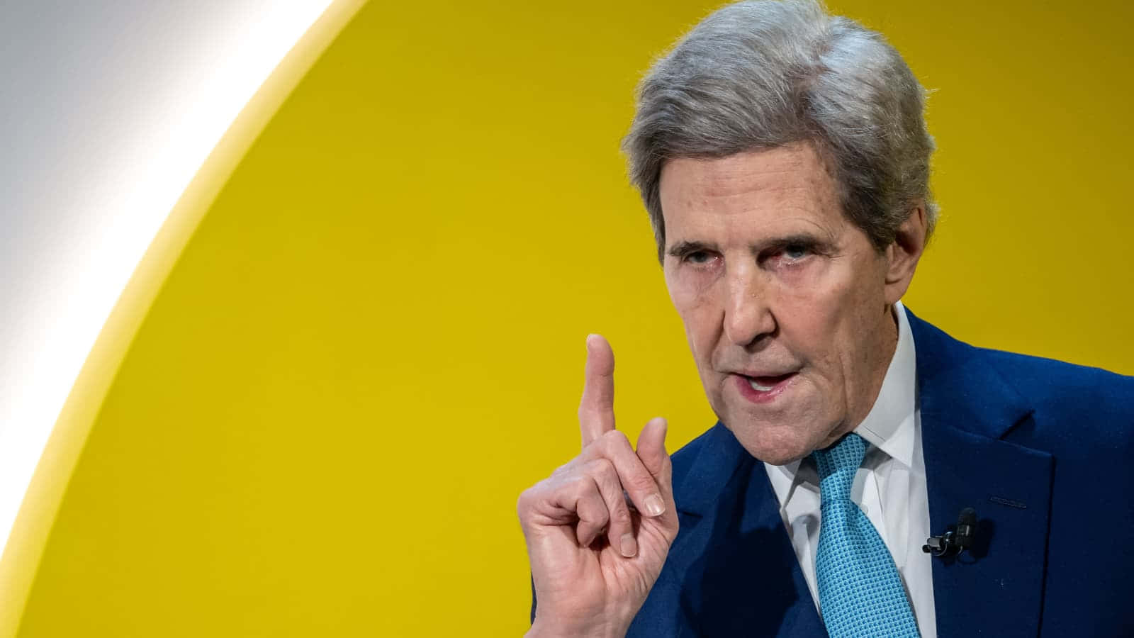 John Kerry With His Index Finger Pointing Upward