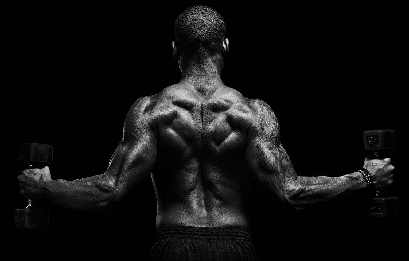 Muscle Man Flexing His Back Wallpaper