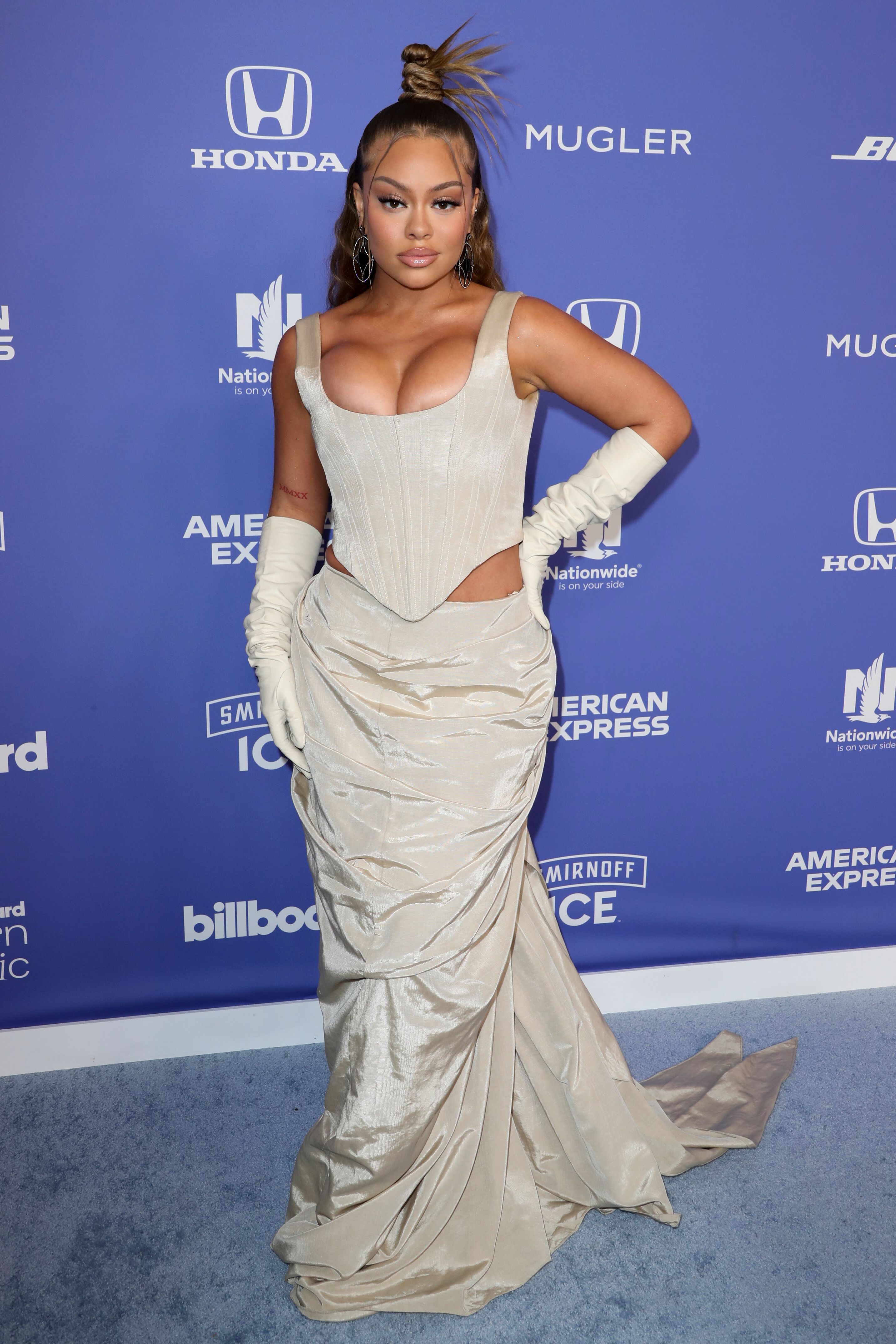 Latto on the Billboard Women in Music Awards 2023 red carpet.