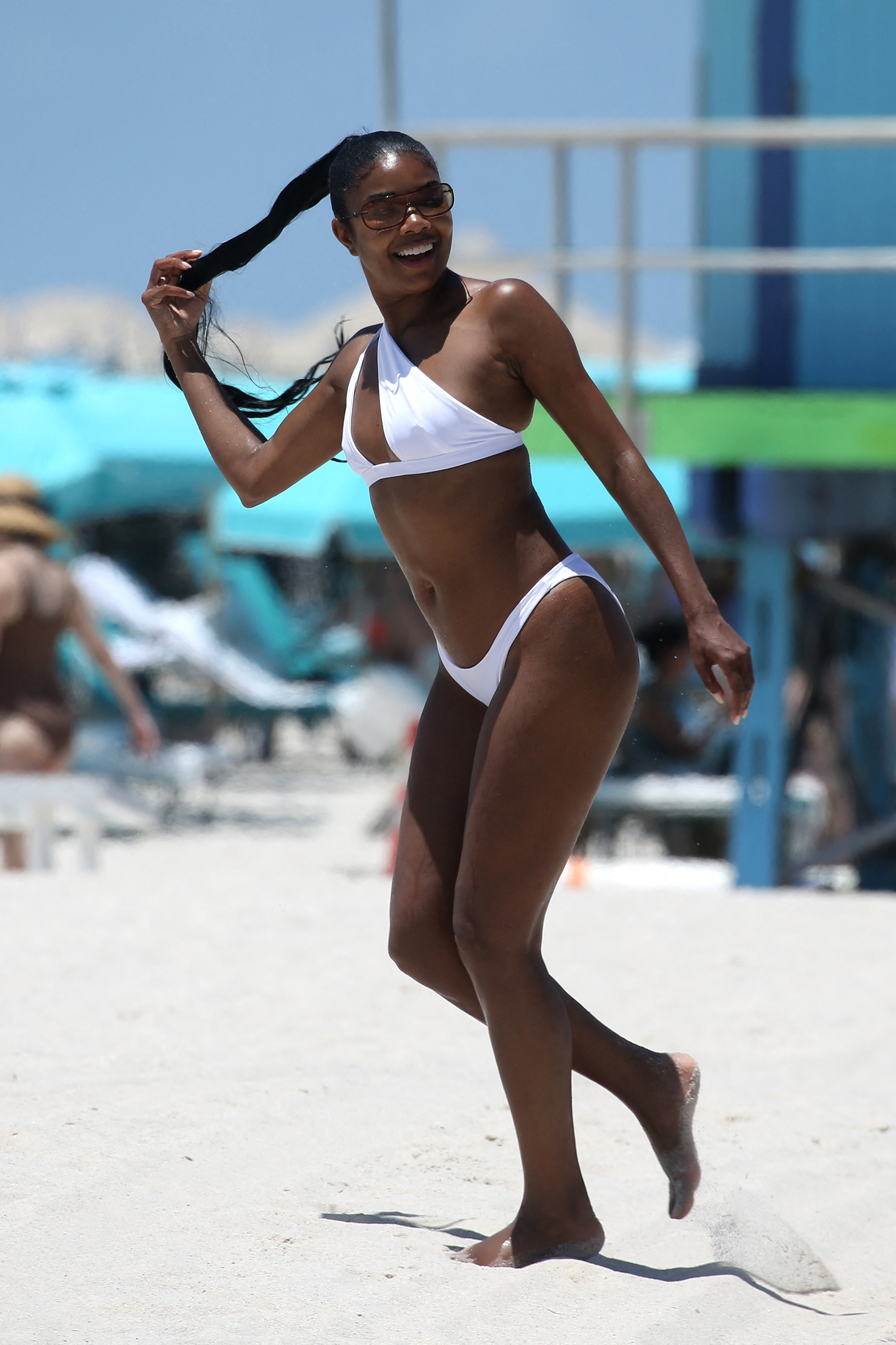 Gabrielle Union soaks up the sun in a teeny white bikini