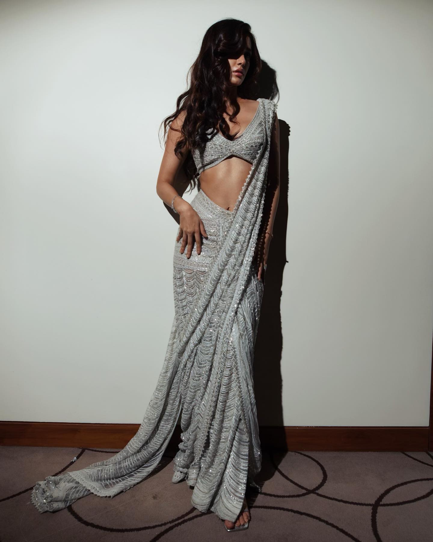 Disha Patani has managed to bedazzle all with her latest photos on Instagram. Draped in a silver-grey saree-lehenga, the actress looks sensational. Indeed, traditional attire accentuates her beauty like no other.