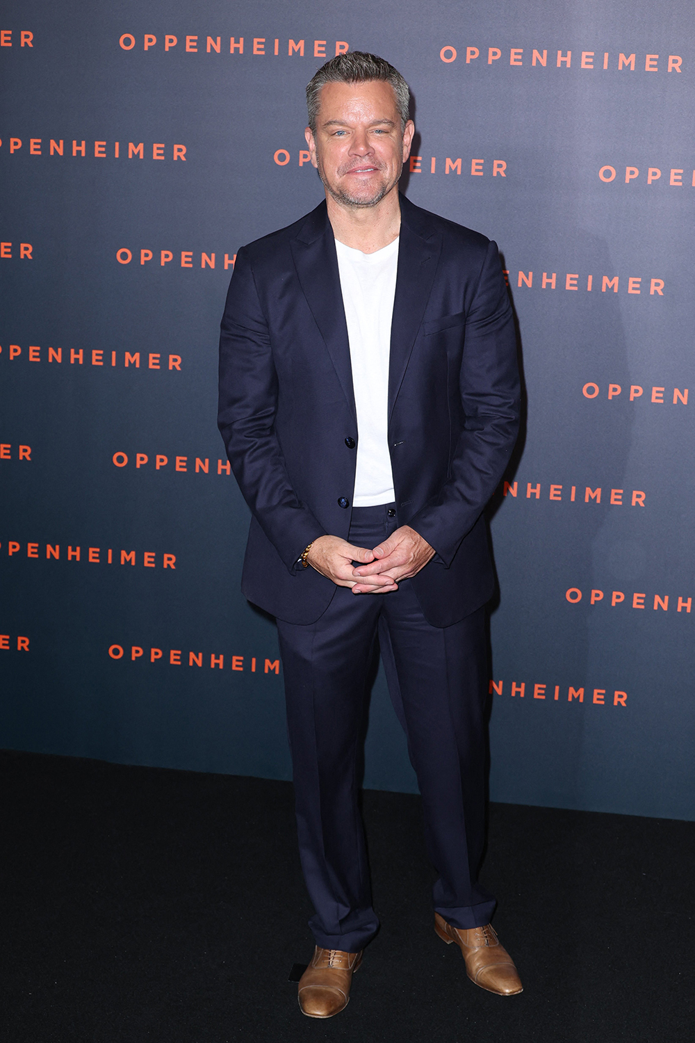 Matt Damon opted for a simple blue suit with a white tee shirt for the ‘Oppenheimer’ premiere in Paris. He finished the look with brown shoes.