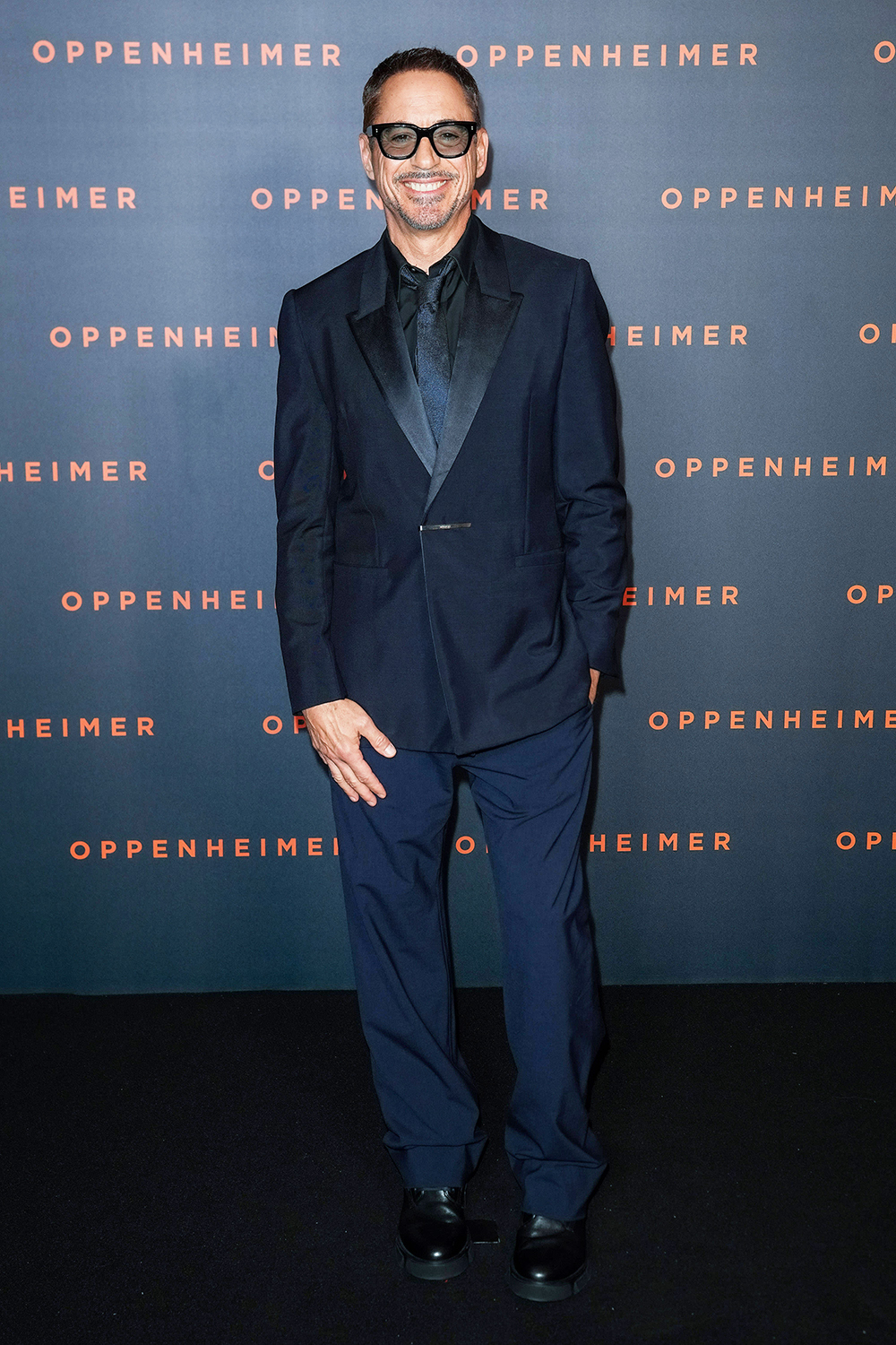 Robert Downey Jr opted for an all-dark ensemble at the ‘Oppenheimer’ premiere in Paris, France, on Tuesday. The ‘Iron Man’ actor flashed his intimitable smile, as well.