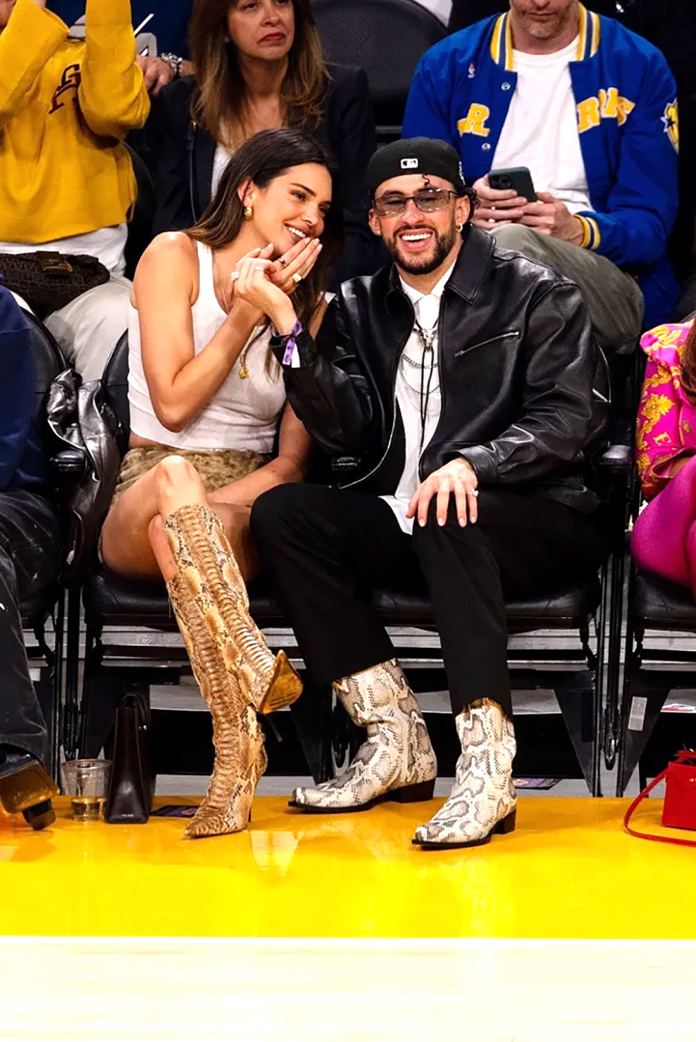 Kendall Jenner and Bad Bunny sparked dating rumors in February 2023 & since then the couple has been going strong. They’re pictured here at the Lakers vs Golden State game in Los Angeles.