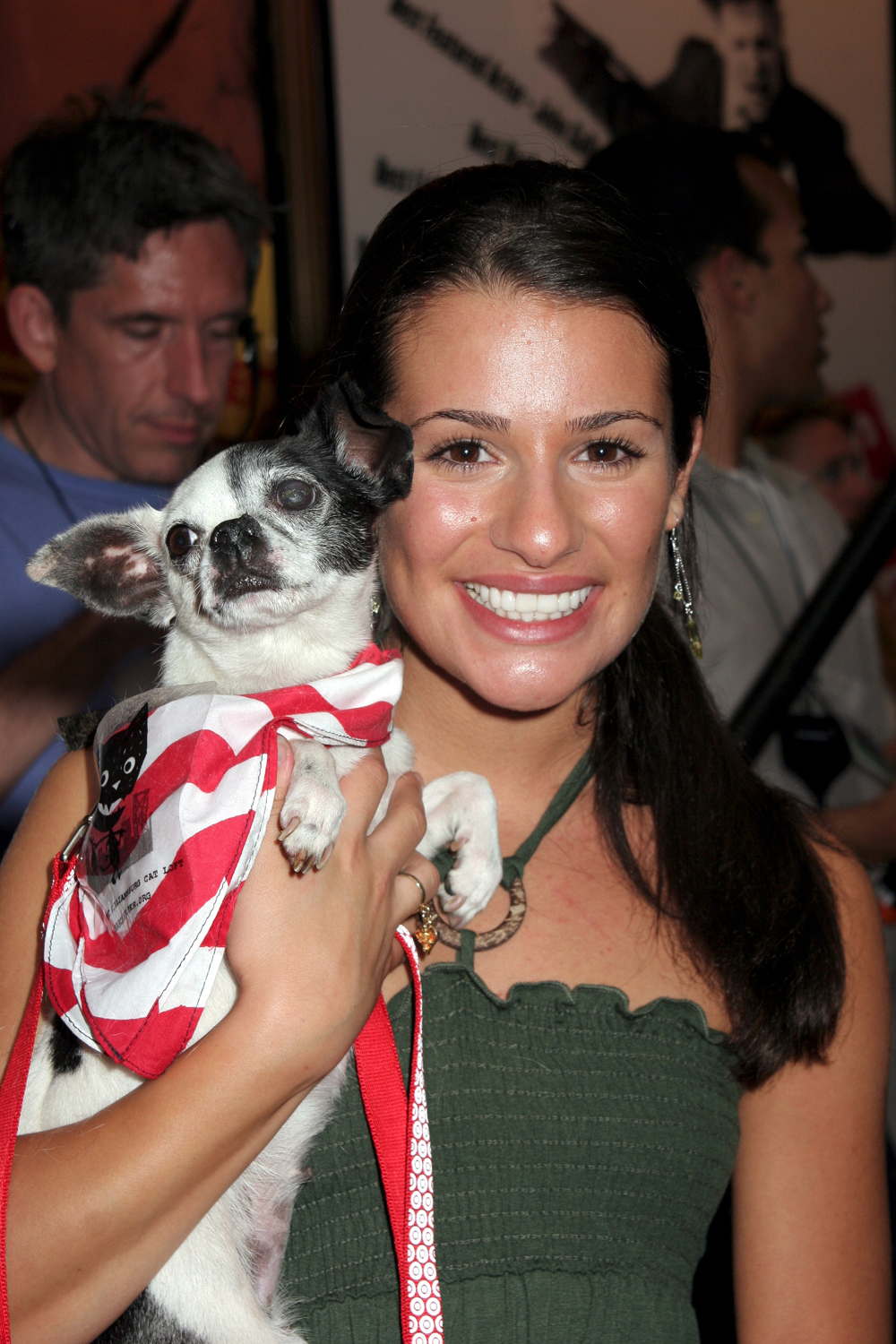 Puppy love! Lea Michele smiles while with her pooch during the Broadway Barks event in New York