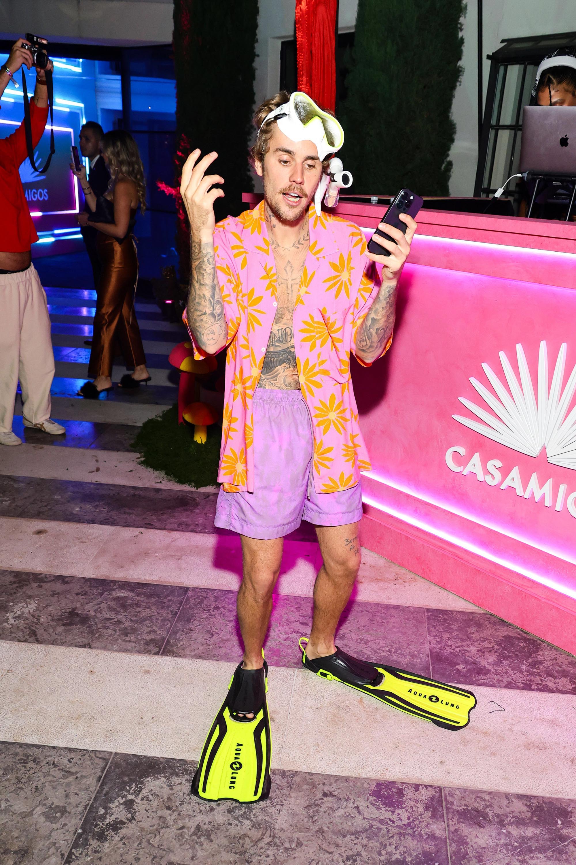 Justin Bieber wore a pink and orange Hawaiian shirt with a snorkel and flippers.
