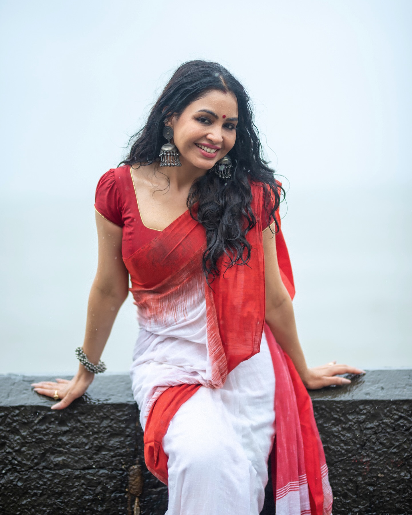 Saranya Chaudhary in red and white sari, portrayed by Indian TV actress Shubhangi Atre